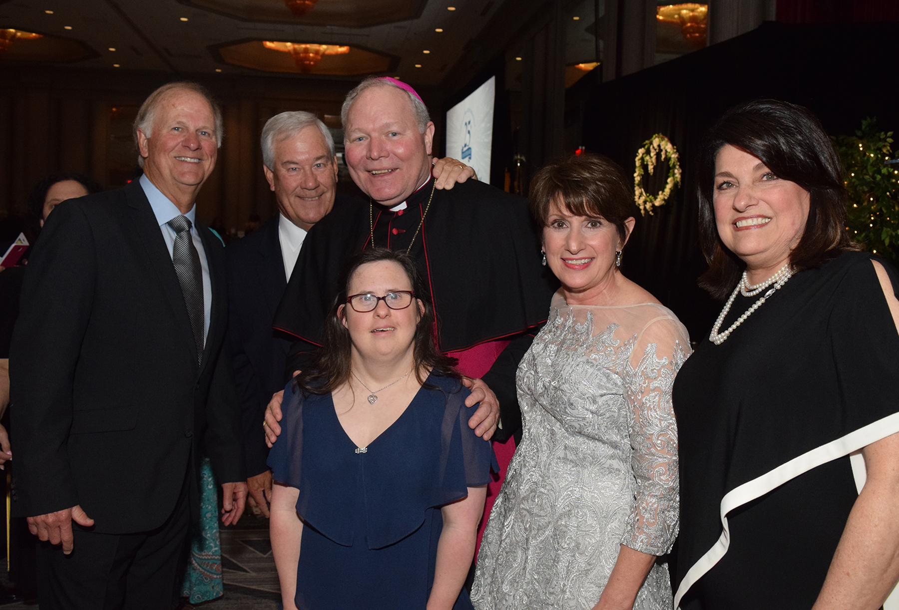 Bishop Burns with Honorary Chairs Marc and Georgia and guests